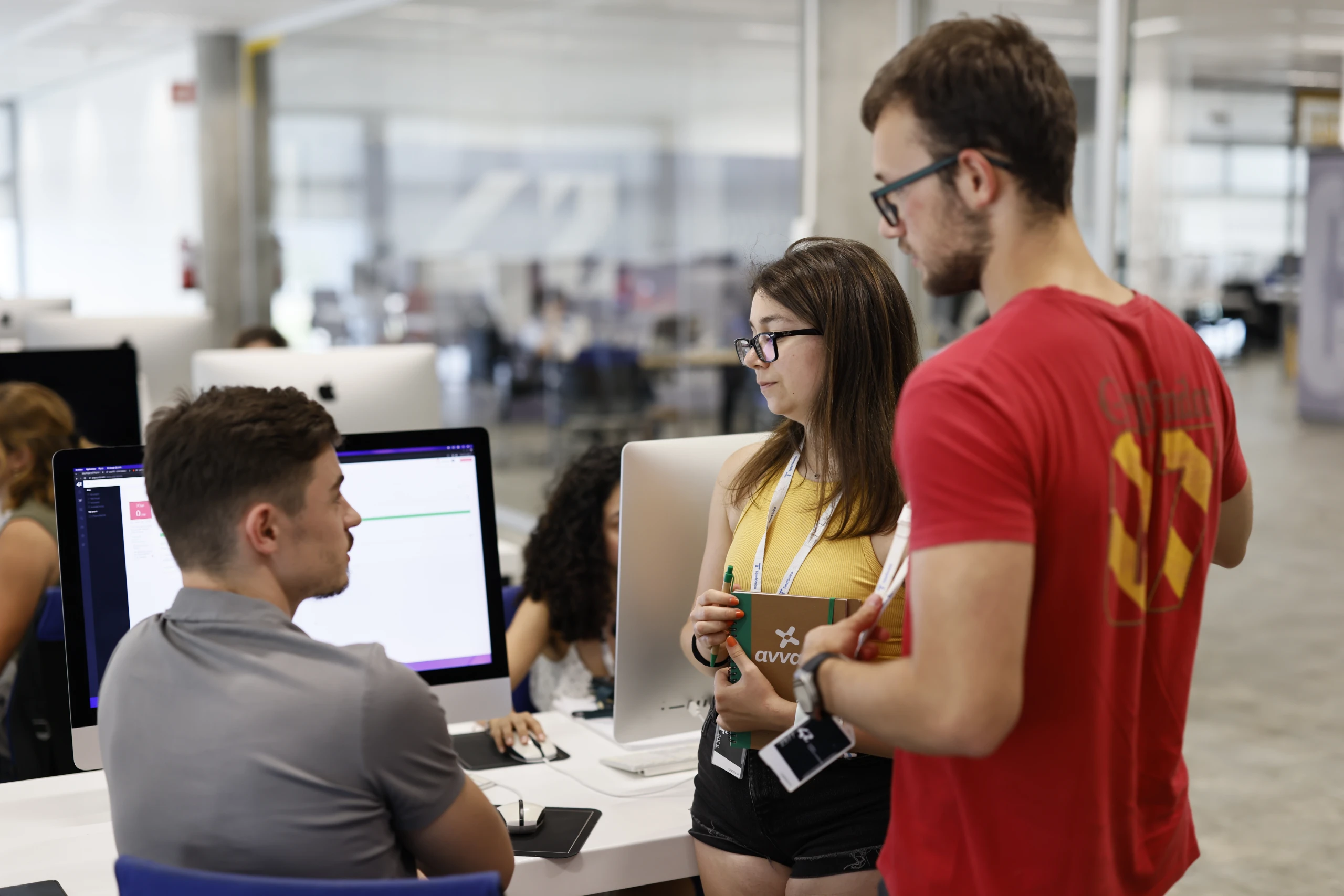 Image of three of the participants in a summer pool at Campus 42 Madrid